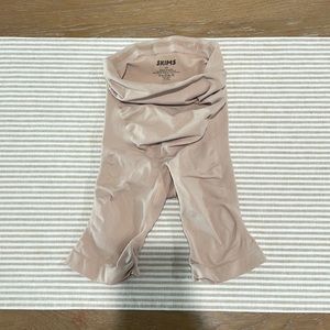 SKIMS Maternity sculpting short mid-thigh.